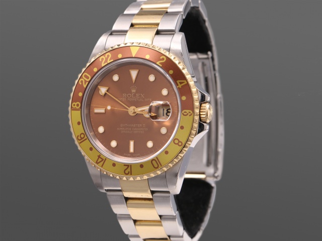 SÅLD - Rolex GMT Master II Guld/Stål 16713 Root Beer, Full set